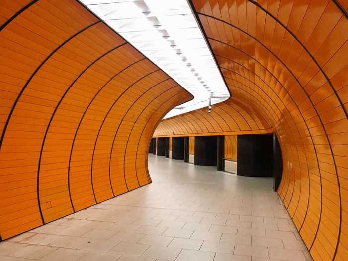 Interior of illuminated orange tunnel
