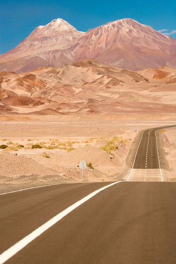 Road against mountains at desert