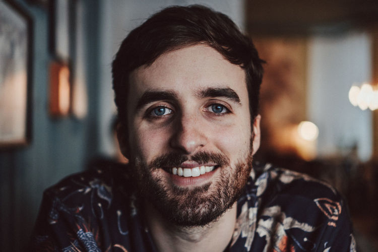 Close-up portrait of smiling young man