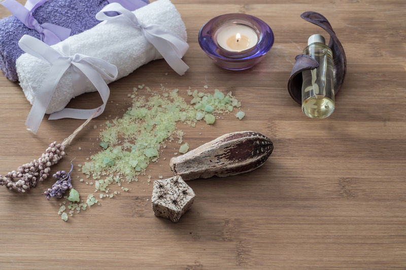 High angle view of spa treatment items on wooden table