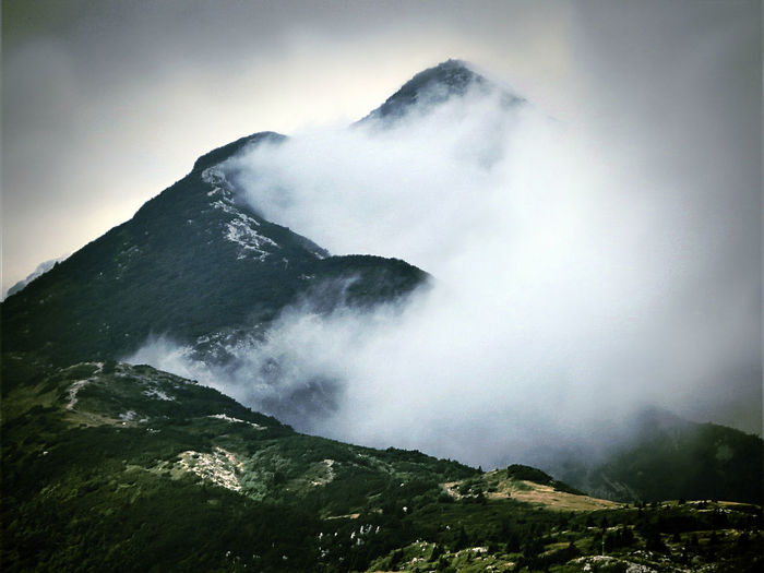Scenic view of mountain in foggy weather