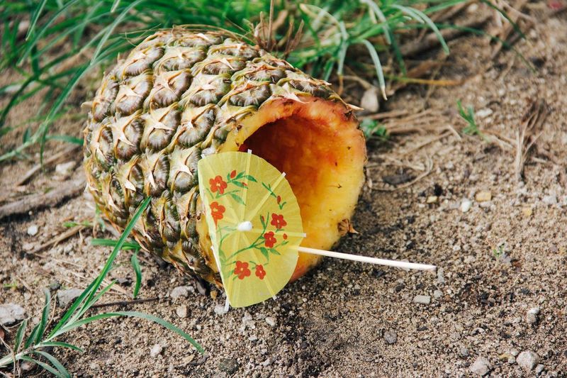 Close-up of pineapple on ground