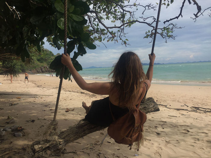 Rear view of woman on beach