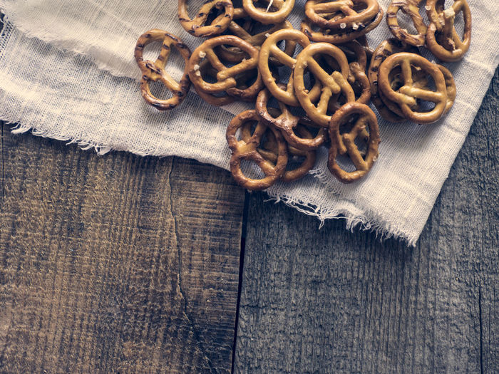 High angle view of wheat pretzels on linen fabric