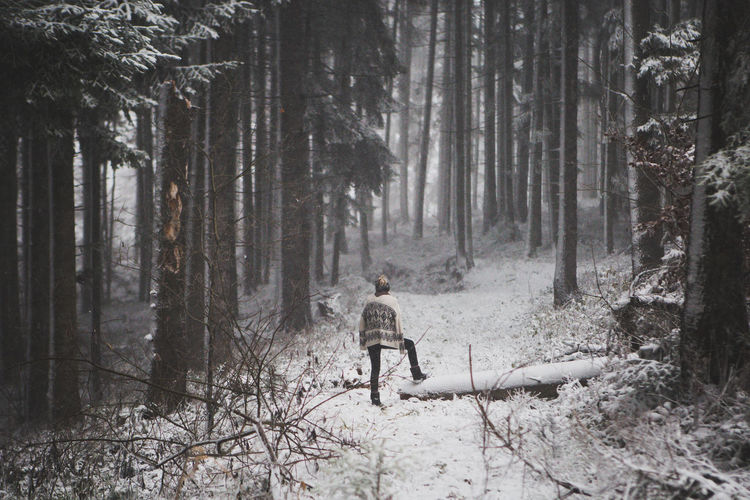 Woman in forest during winter