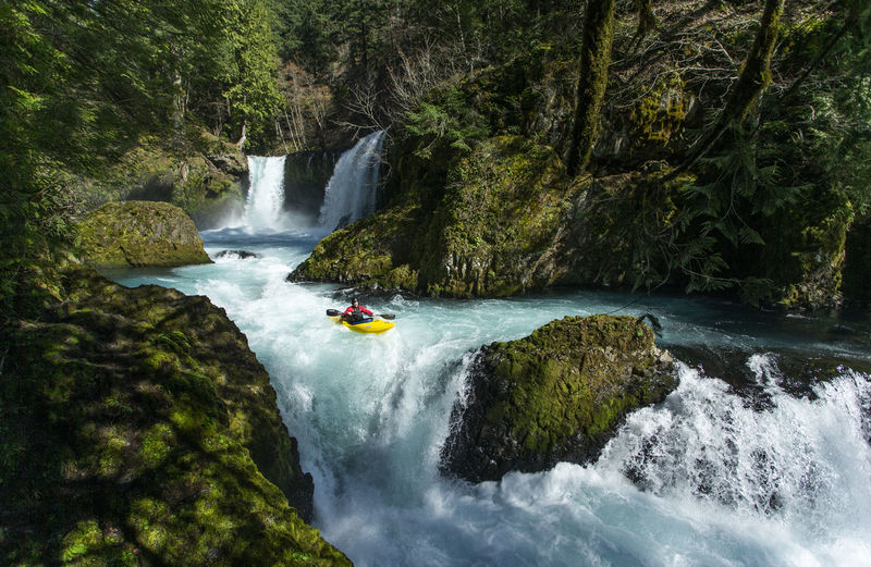 A kayaker descends the little white salmon river in wa.