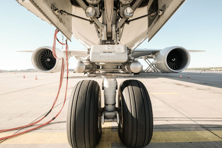 Close-up of airplane on airport runway