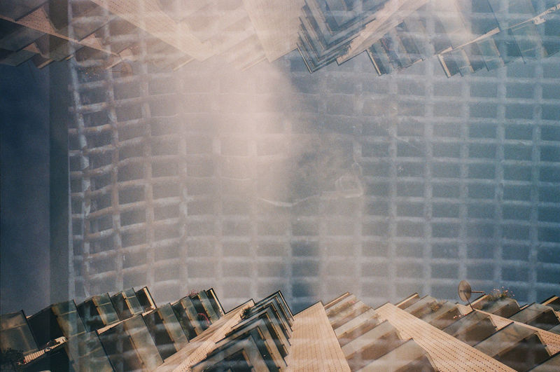 Directly below shot of building seen through glass