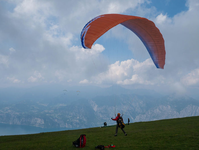 Low angle view of man paragliding