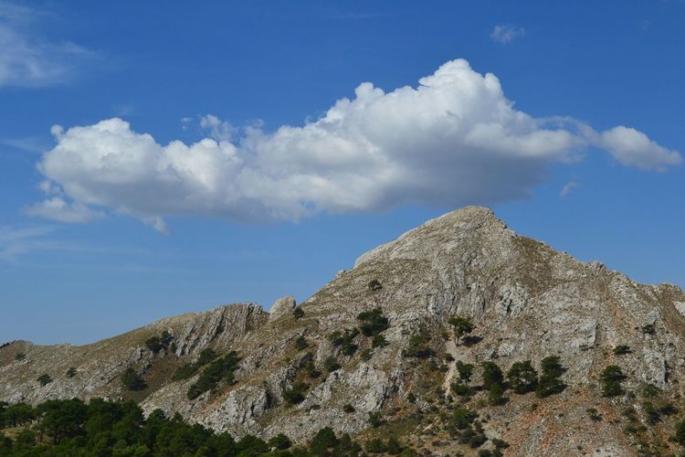 Low angle view of rock formations against sky