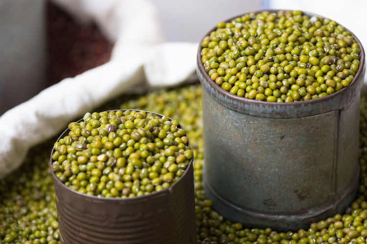 Close-up of mung beans with containers