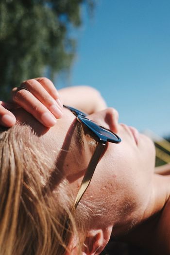 High angle view of young woman sunbathing