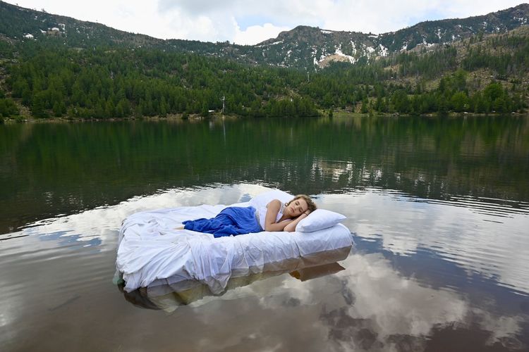 Woman lying in lake
