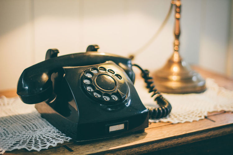 Close-up of vintage landline phone on table