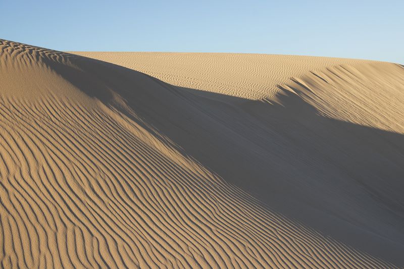 Scenic view of desert against clear sky