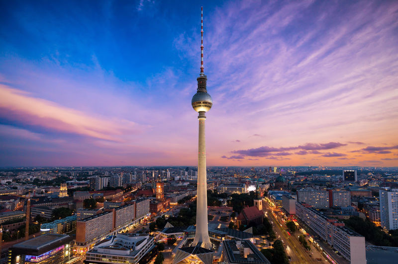 Fernsehturm amidst illuminated city at night