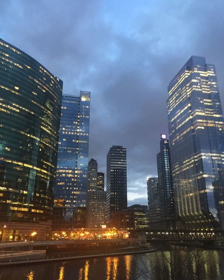 Illuminated cityscape against sky at night