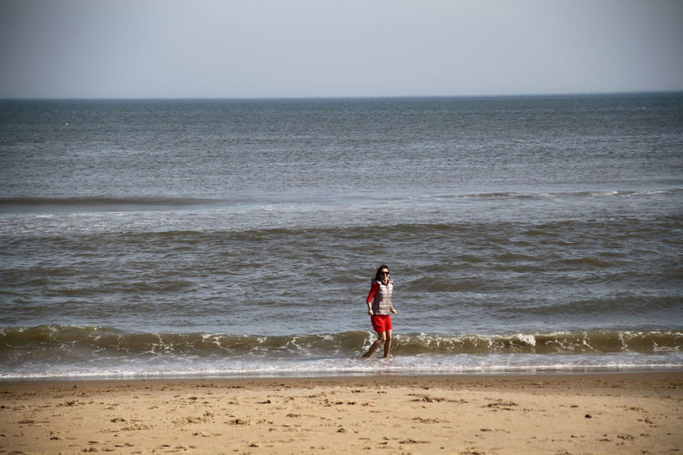 Woman enjoying at sea shore