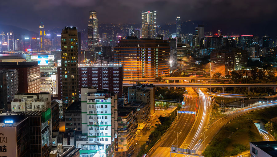 High angle top view of illuminated city buildings at night,hong kong