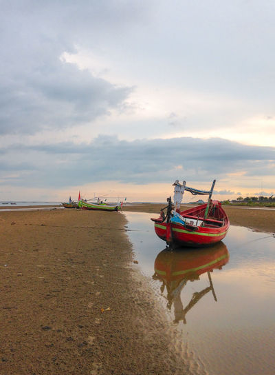 View of fishing boat on beach