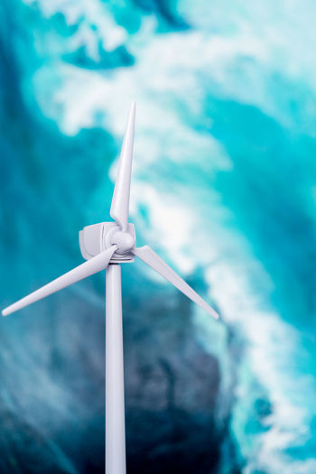 Low angle view of windmill against sky