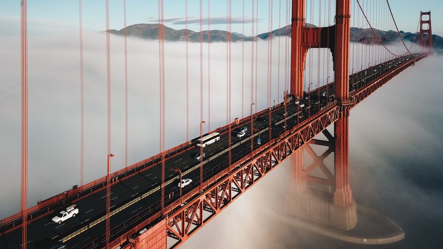 Golden gate bridge over river against sky