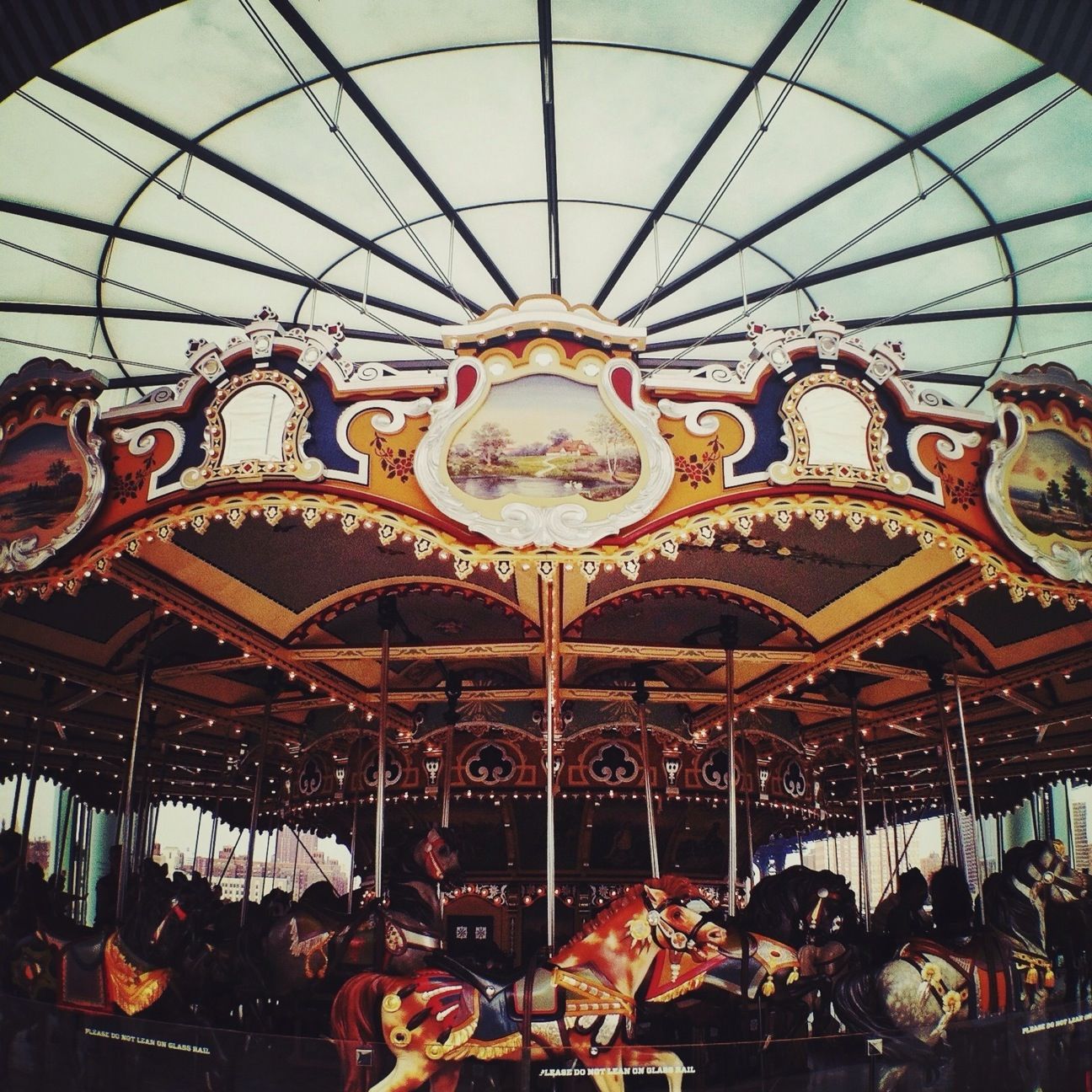 indoors, low angle view, ceiling, amusement park, decoration, art and craft, amusement park ride, art, arts culture and entertainment, creativity, hanging, illuminated, ornate, multi colored, design, carousel, animal representation, cultures, lighting equipment, built structure