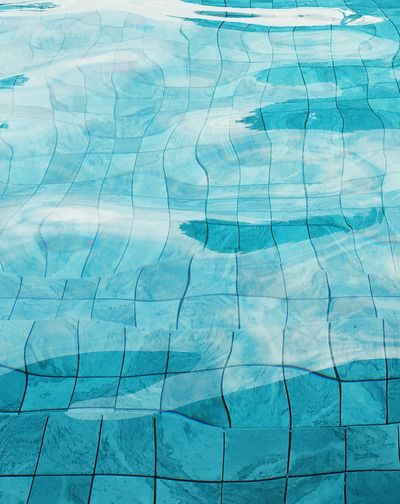 Full frame shot of swimming pool and tiled floor