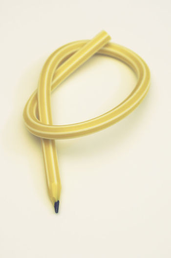 High angle view of yellow container on white background