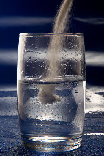 Close-up of ice on glass table