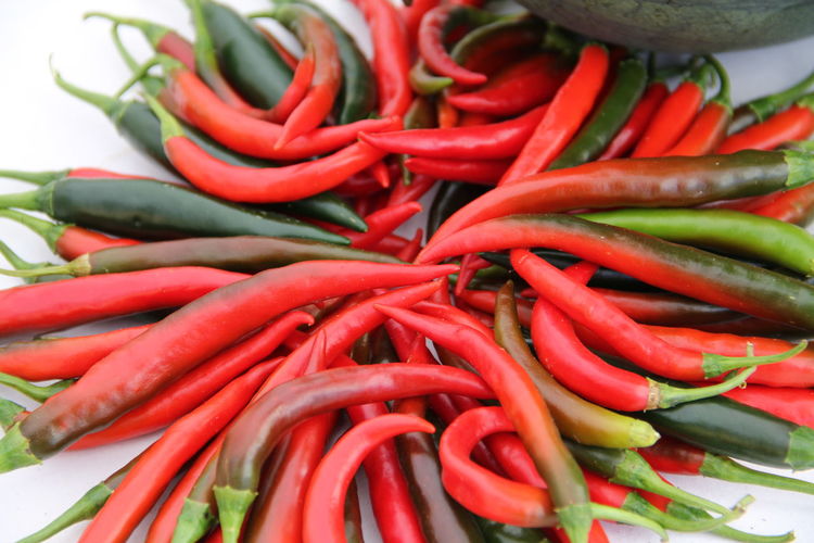 Close-up of chili peppers on table
