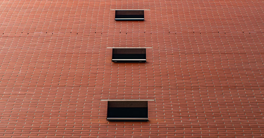 Low angle view of brick wall