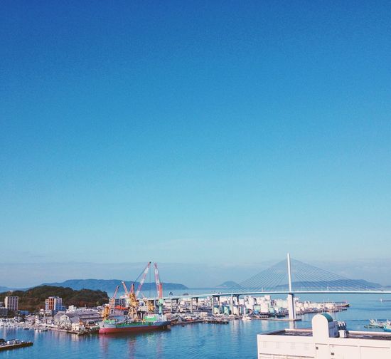 Scenic view of sea against clear blue sky