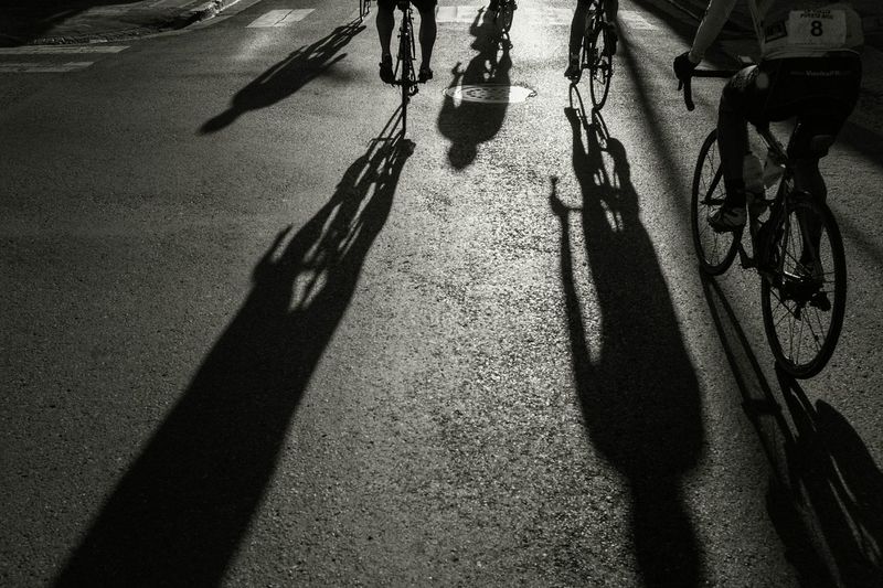 Shadow of people on road
