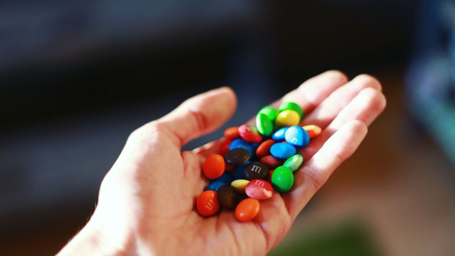 Close-up of hand holding candies