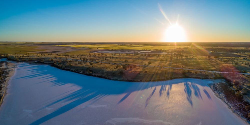 Sunset over desert and salt lake in australia - aerial panorama
