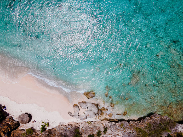 High angle view of rock formation in sea