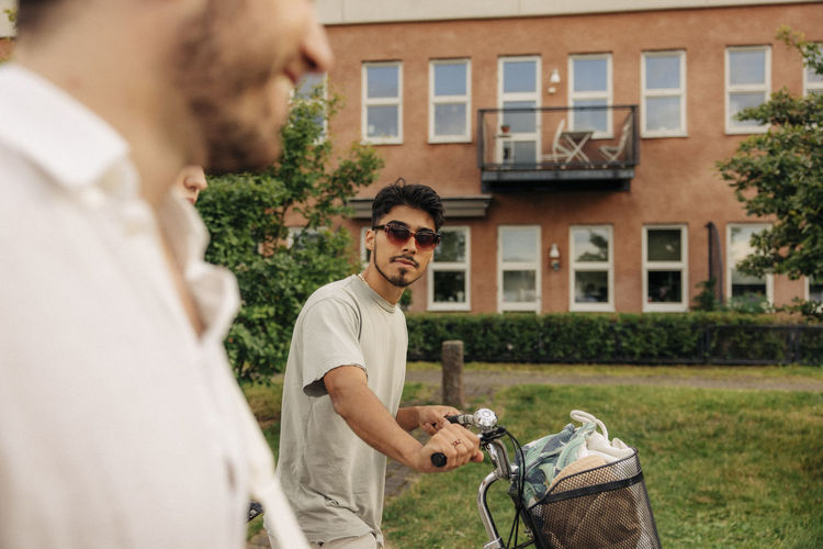 Side view of man with bicycles
