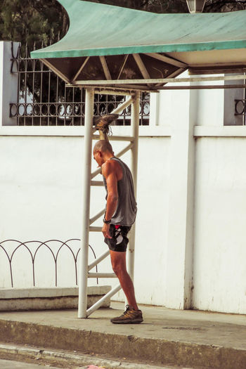Side view of man exercising in park 