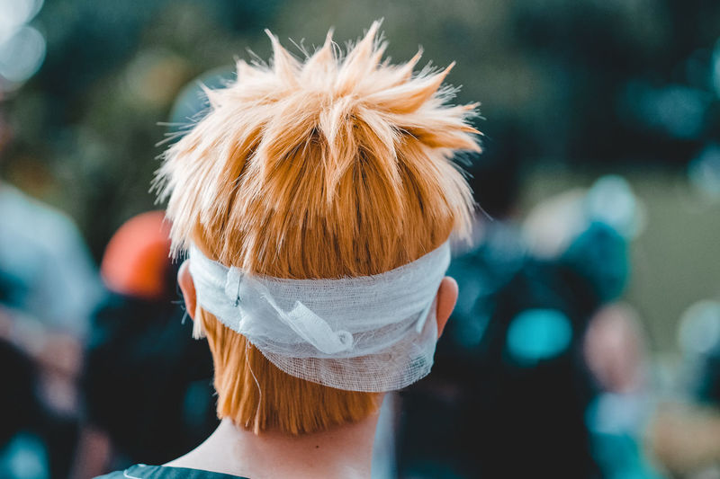 Close-up of bandage wrapped on woman head outdoors