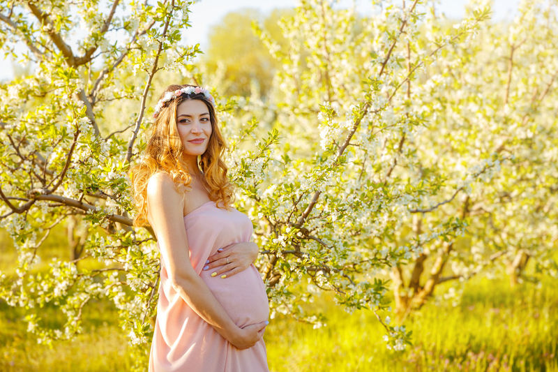 Beautiful pregnant woman in the park. pregnancy woman in the garden.