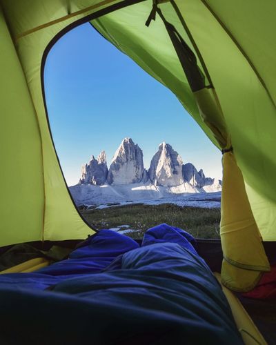 Scenic view of mountains seen through tent