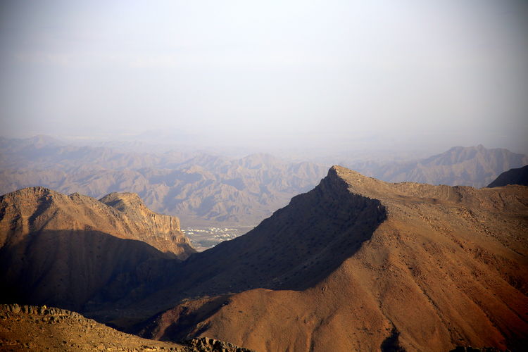 View of the mountains with a glimpse of the city below, jabal akhdar, towards nizwa, oman