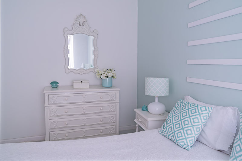 Shabby chic style mint pastel bedroom. cozy bright and light bedroom with decor