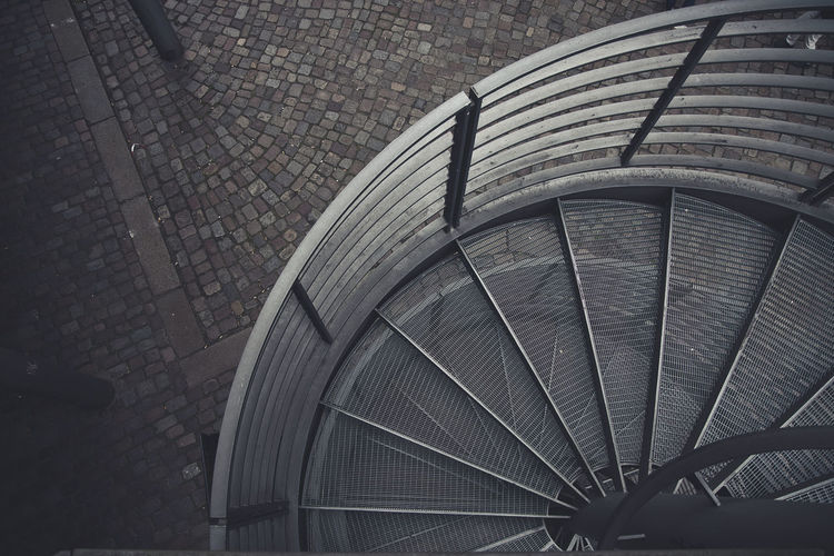 High angle view of metallic structure on footpath