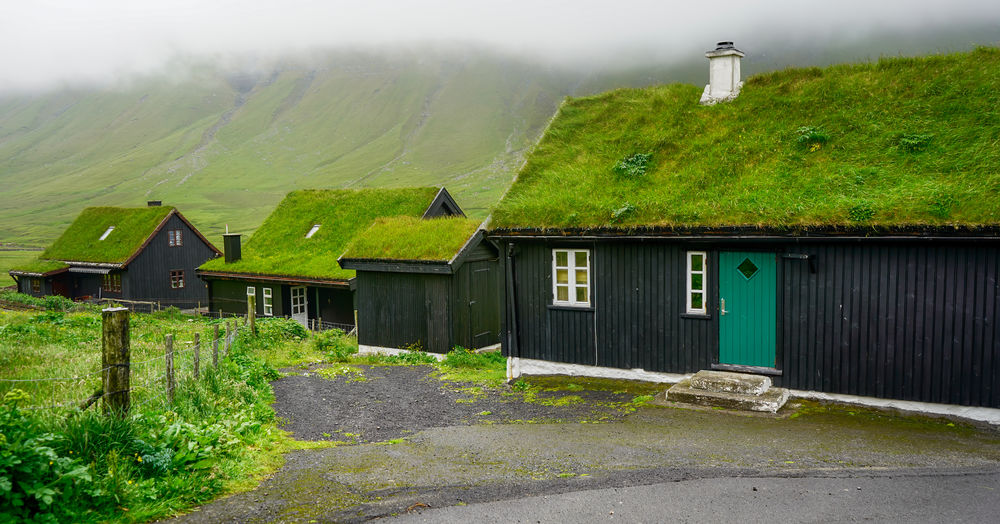 Typical faroese village with traditional grass roof houses bour village. vagar island, 