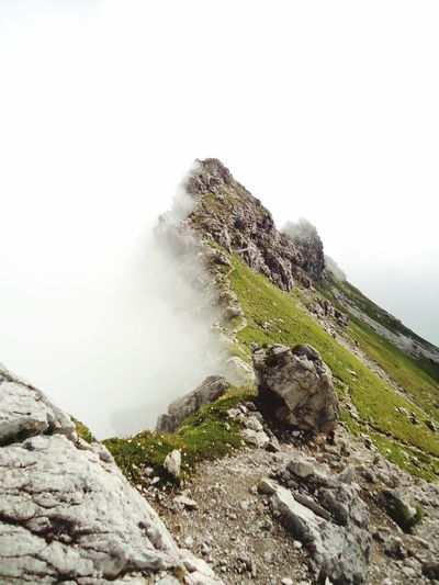 Rocks on mountain against clear sky