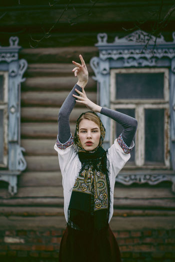 People Day Outdoors Adult Adults Only Young Adult One Person One Woman Only Arts Culture And Entertainment Human Body Part Only Women The Portraitist - 2017 EyeEm Awards Arms Raised Front View Real People Young Women Built Structure Architecture Standing Focus On Foreground Lifestyles Leisure Activity Dancing Fashion Beautiful Woman Portrait Building Exterior