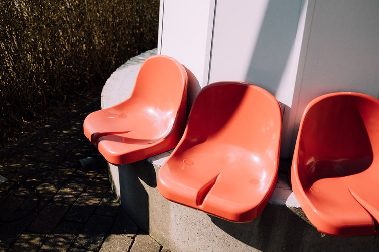 Close-up of red chairs