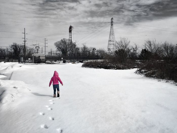 People standing on snow covered landscape